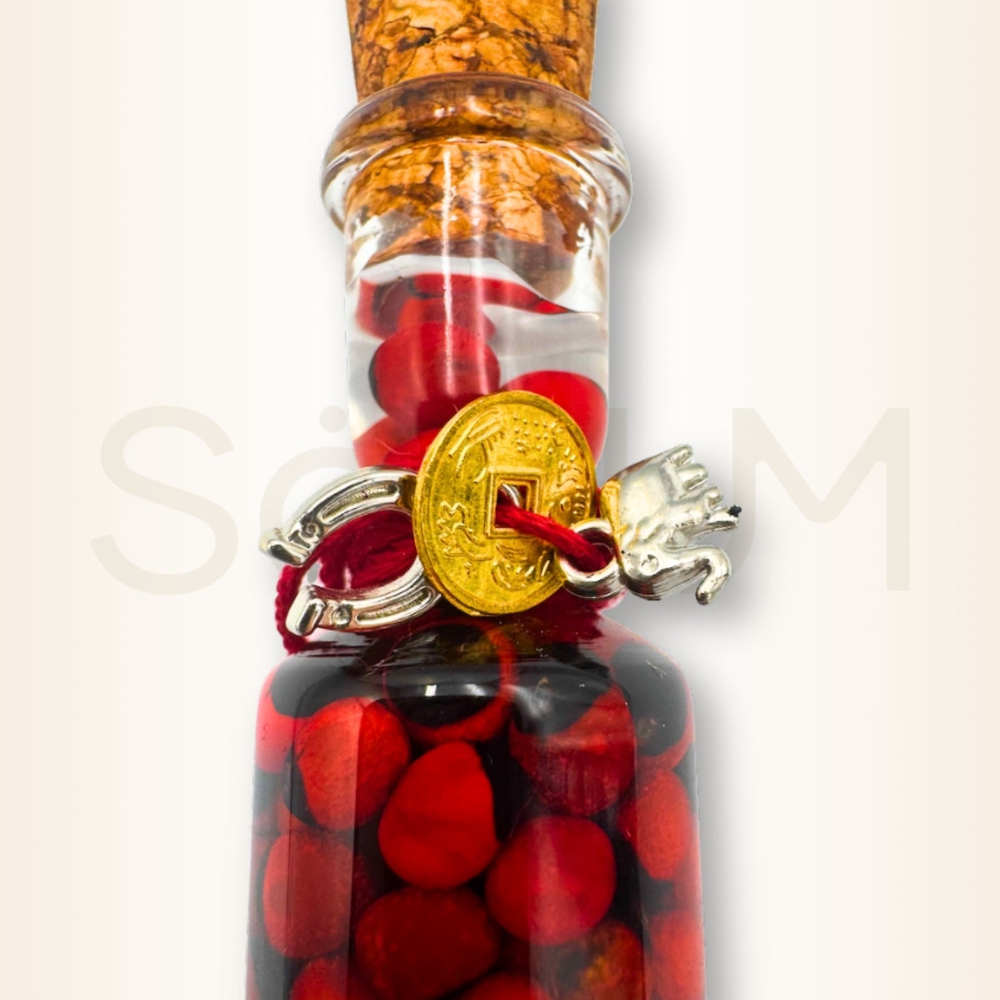 Sticlă cu semințe Huayruro, elefant și potcoavă - pentru prosperitatea casei