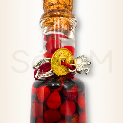 Sticlă cu semințe Huayruro, elefant și potcoavă - pentru prosperitatea casei